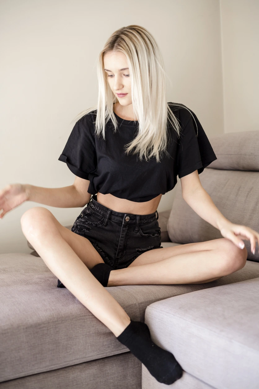 Portrait of relaxed woman sitting on couch